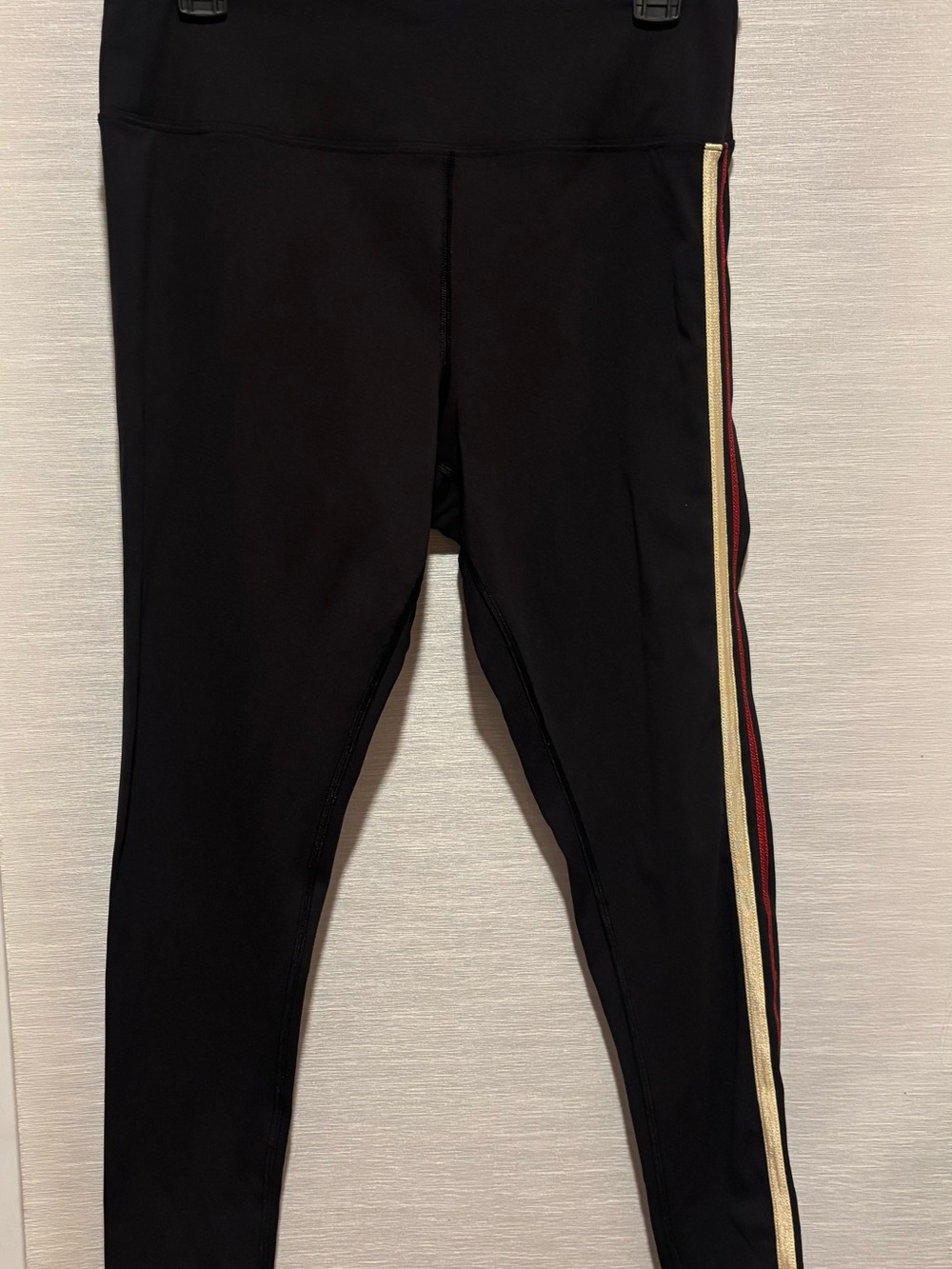 FP Movement by Free People Black Leggings with Gold and Red Side Stripes